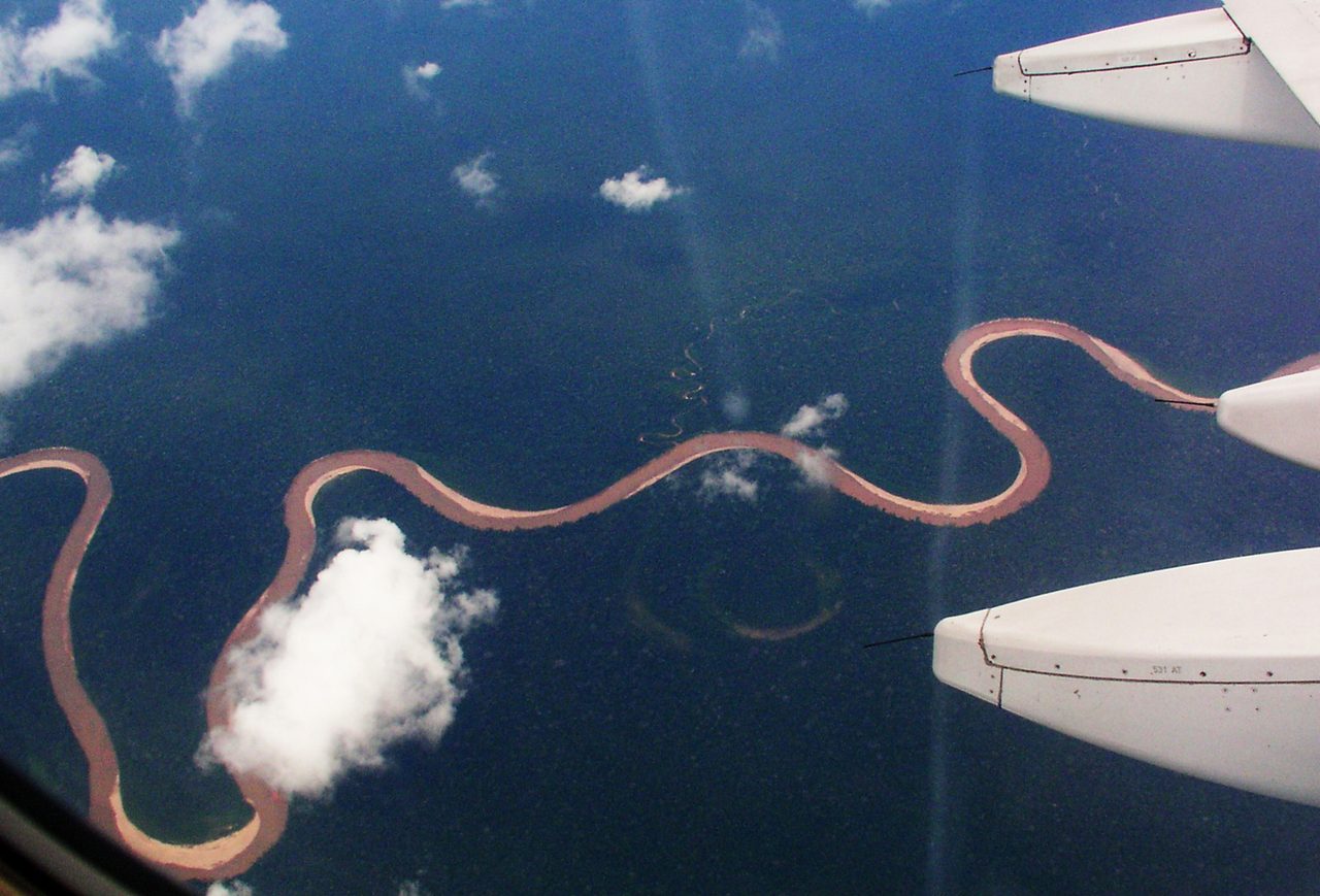 Aerial view of a winding jungle river on the flight into the Peruvian Amazon