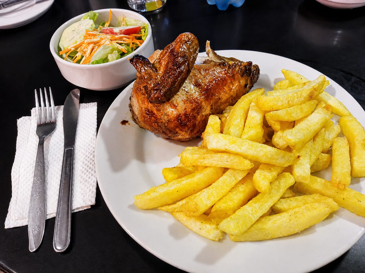 Pollo a la brasa, Peruvian rotisserie chicken with fries and salad