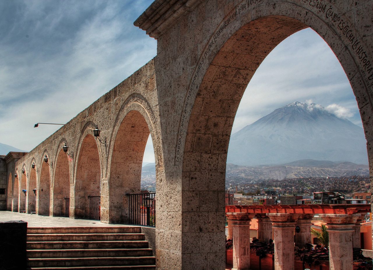 The sillar archways of the Yanahuara viewpoint framing El Misti volcano in Arequipa