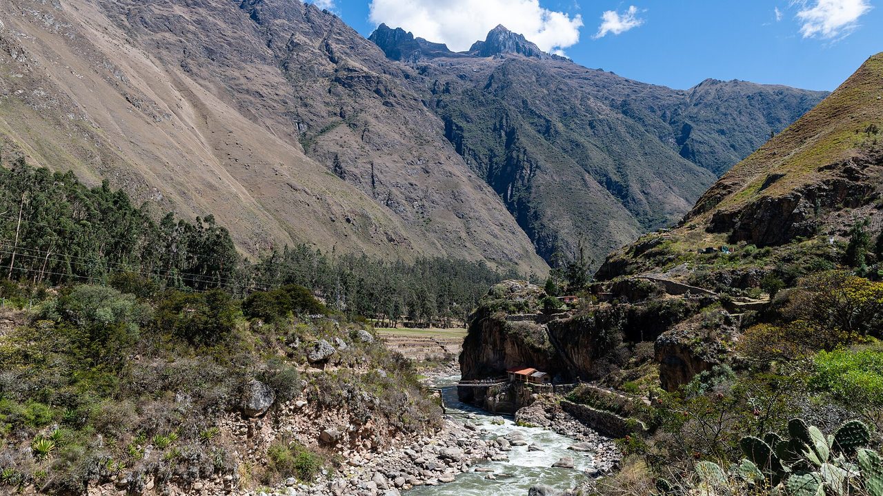 The panoramic view from the Machu Picchu Mountain trail with Huayna Picchu behind the citadel