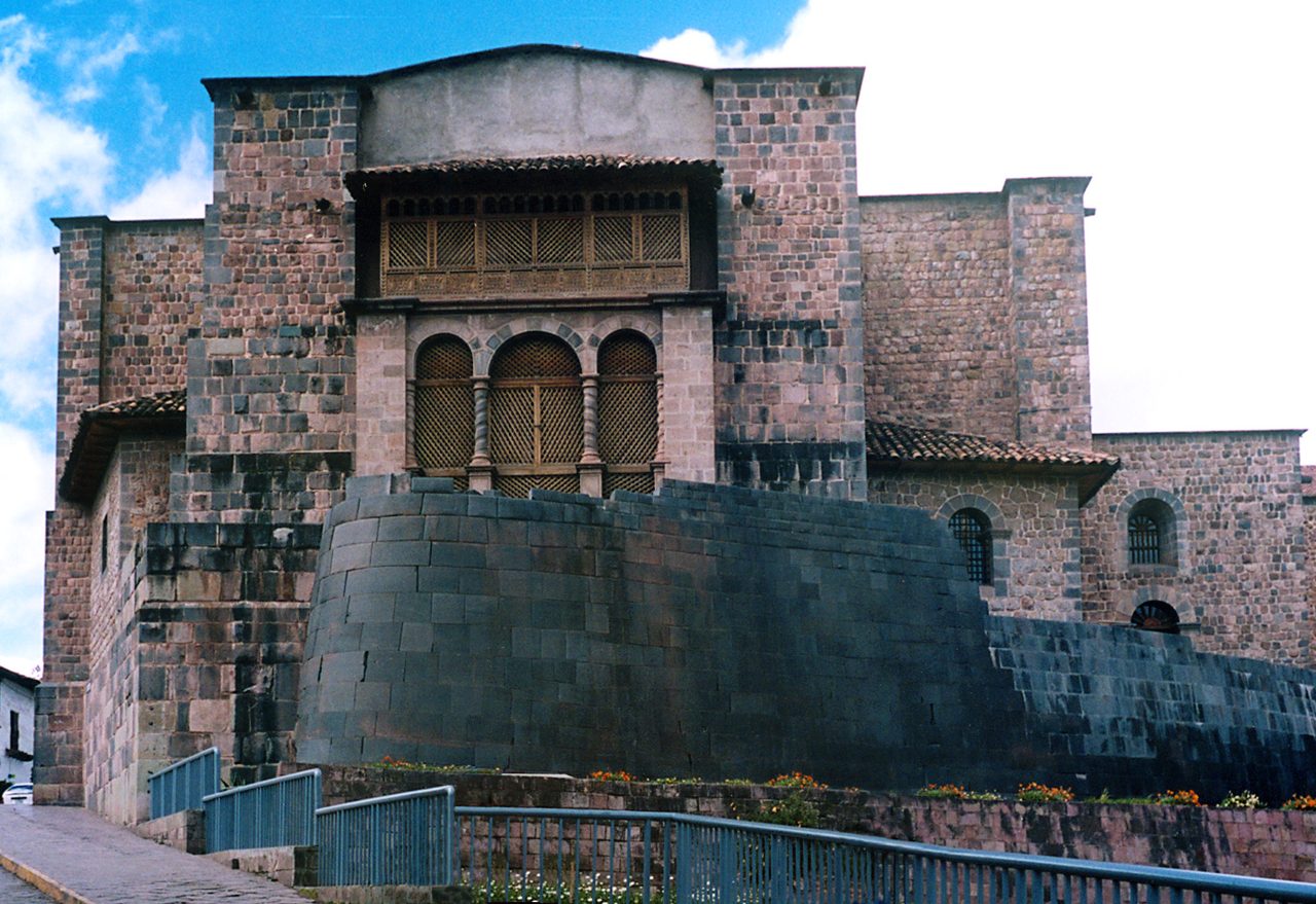 The curved Inca wall of the Qorikancha in Cusco with the colonial church of Santo Domingo built on top of it