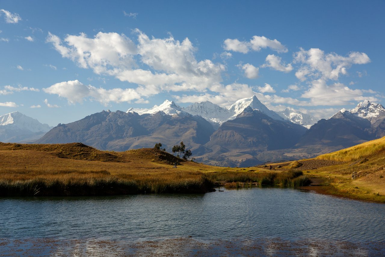 Laguna Wilcacocha above Huaraz with the snow-capped peaks of the Cordillera Blanca on the horizon