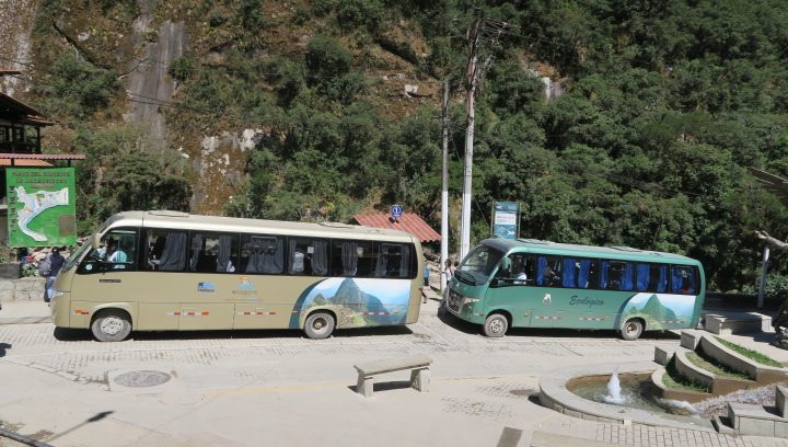 Two Consettur shuttle buses waiting in Aguas Calientes before the climb up to the Machu Picchu gate