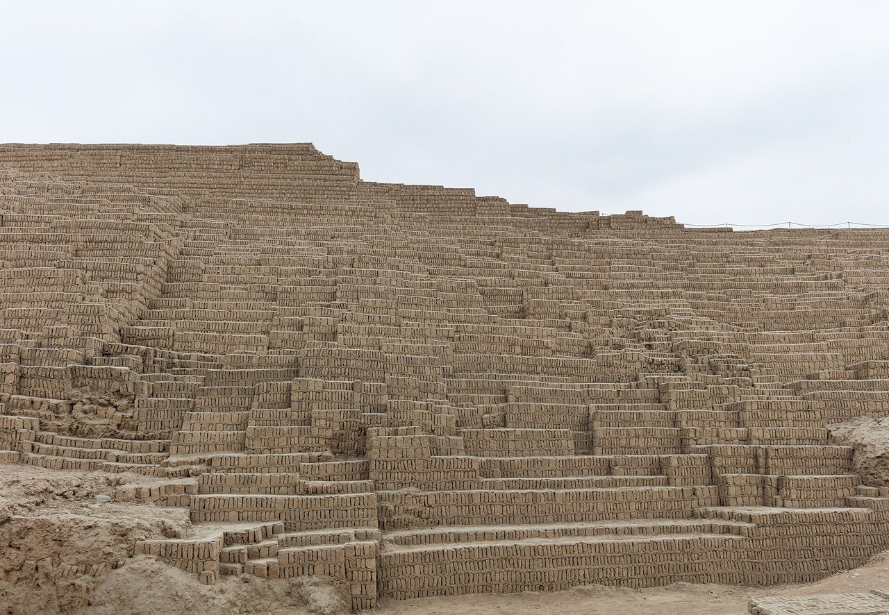 The stepped adobe brick terraces of the Huaca Pucllana pyramid in Lima, built from thousands of small hand-made bricks set on end