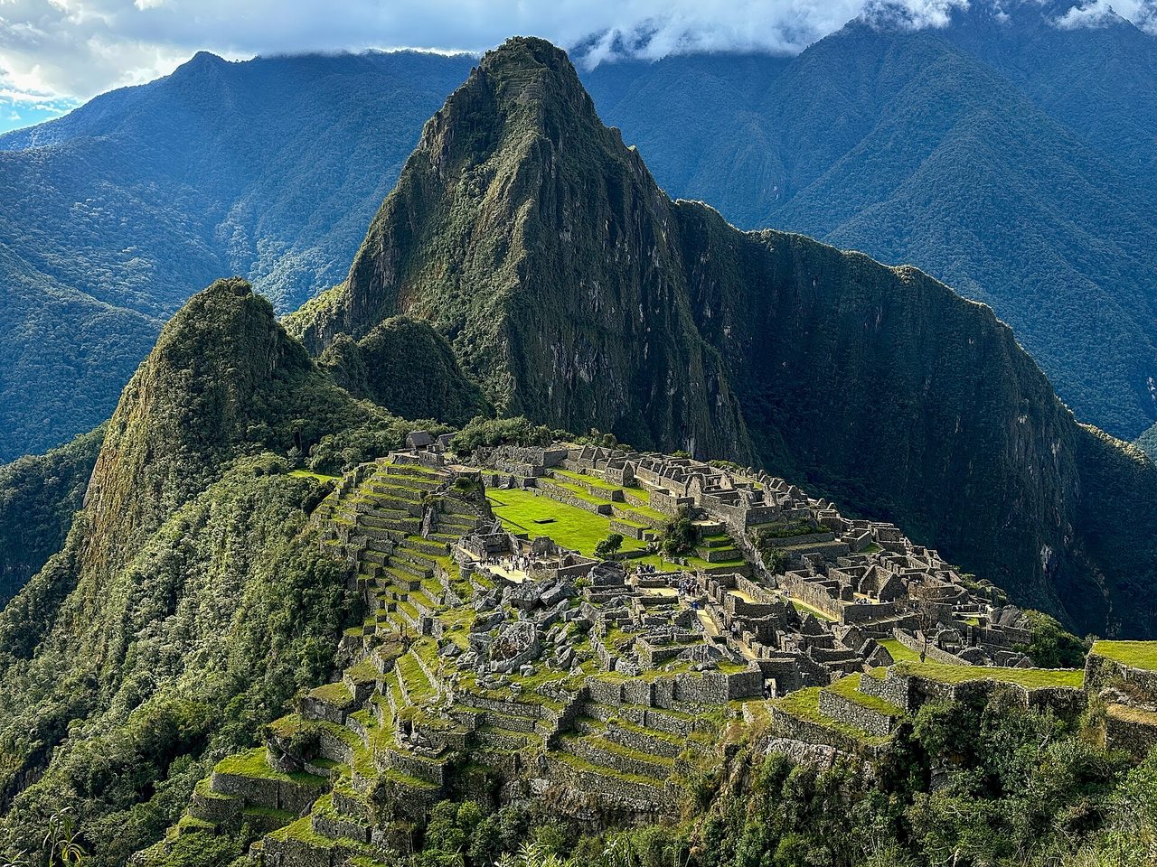 The classic view of Machu Picchu from the guardhouse, with agricultural terraces and Huayna Picchu behind
