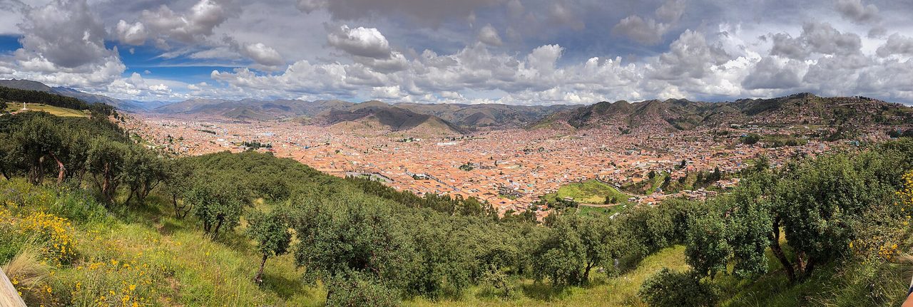 Panoramic view over the terracotta rooftops of Cusco from the hillside at Sacsayhuaman