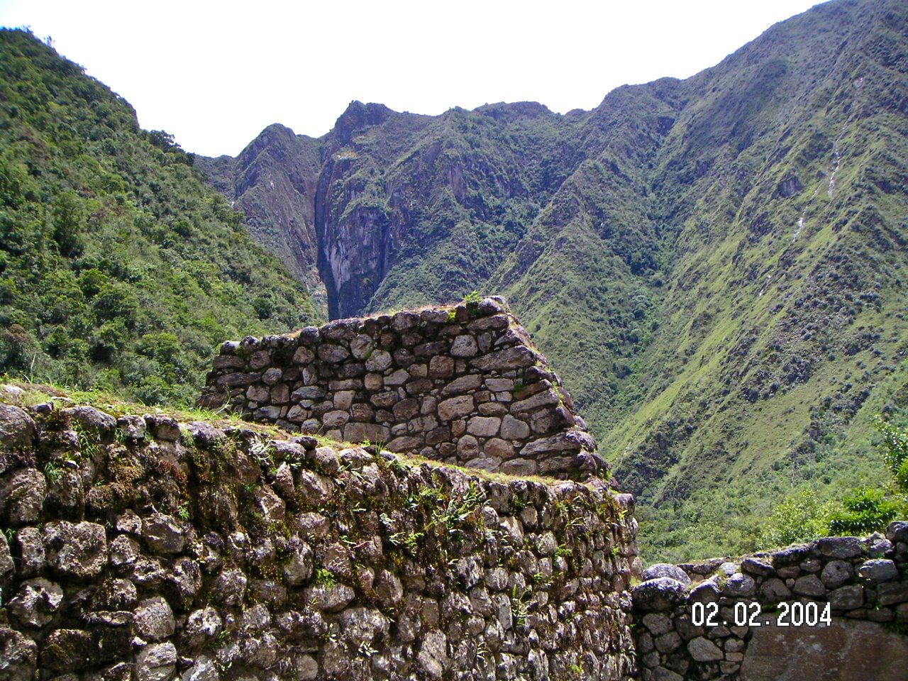 Inca dry-stone walls on the trail above the steep, forested Urubamba canyon near Machu Picchu