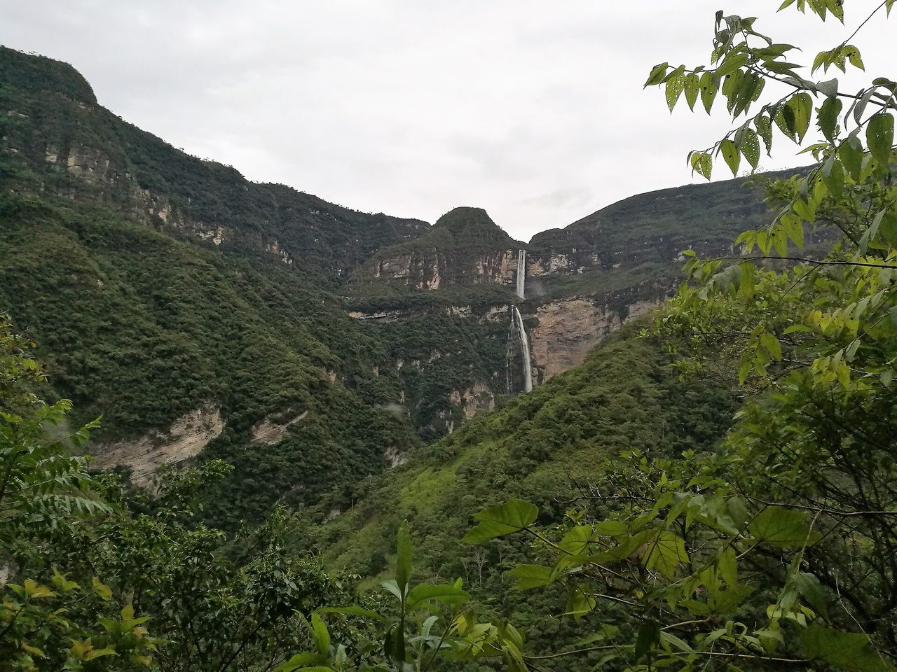 The two-tier Gocta waterfall dropping down a forested cliff, seen from the trail out of Cocachimba in Peru's Amazonas region