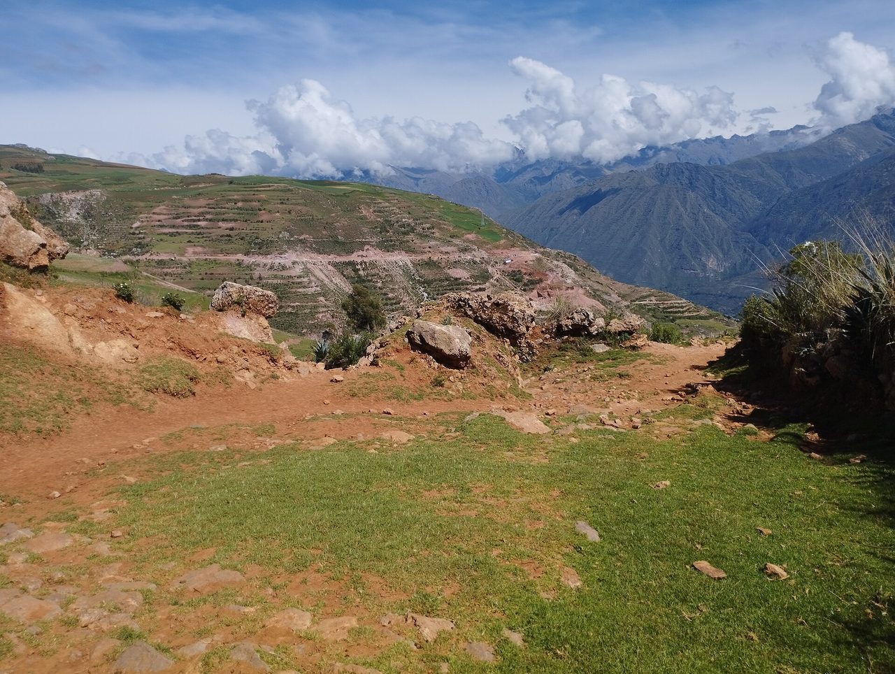 Terraced farmland and an eroded ridge on the walking route down to Yucay in the Sacred Valley