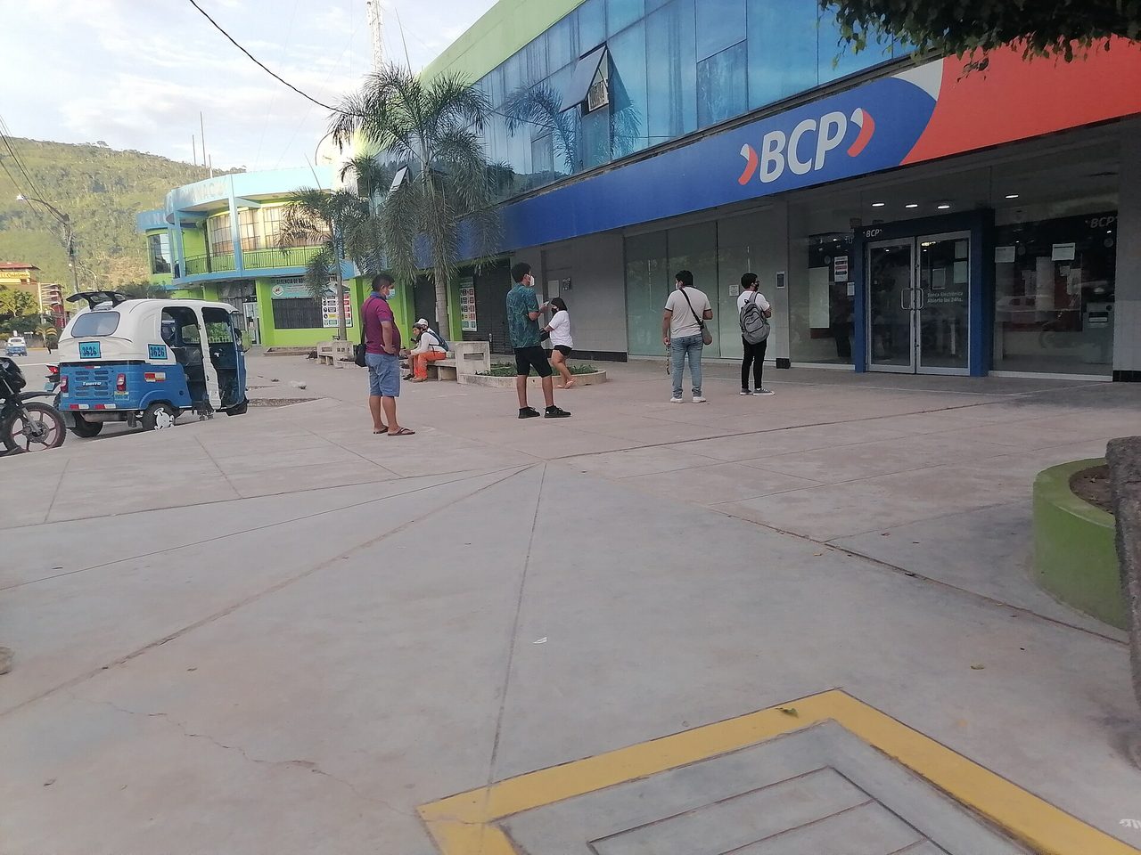 A BCP branch in a small Peruvian town, with a mototaxi parked on the street outside
