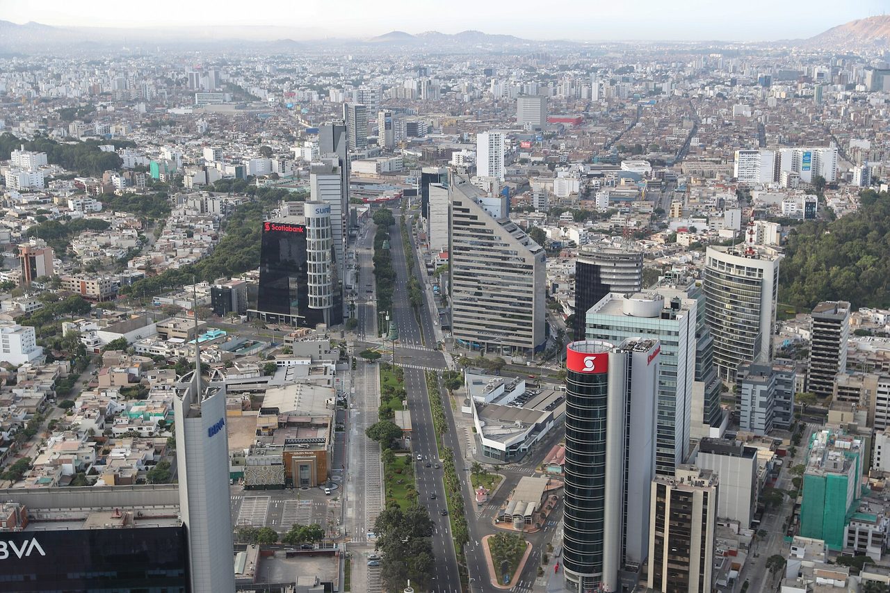 Aerial view over Lima’s San Isidro financial district, with the Scotiabank and BBVA towers beside a main avenue