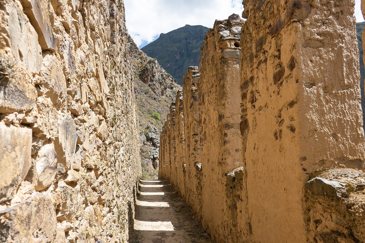 A narrow passage running between the walls of the Inca storehouses at Pinkuylluna, above Ollantaytambo